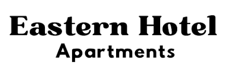 A black and white image of a sign that says "Eastern Hotel Apartments".